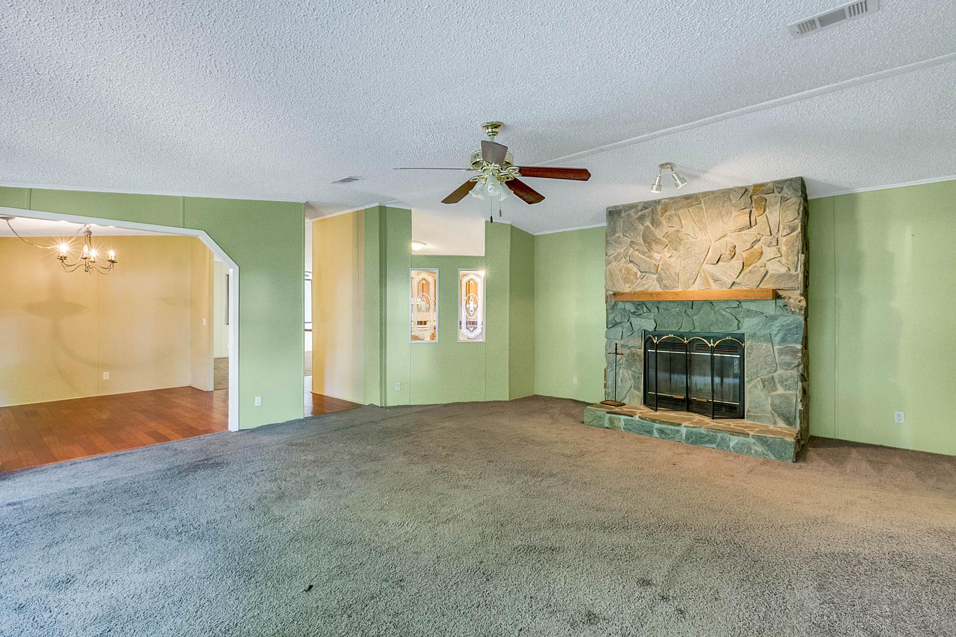 11612-North-St.--Gibsonton--FL-33534--02--Living-Room-No-Fire-in-Fireplace.jpg